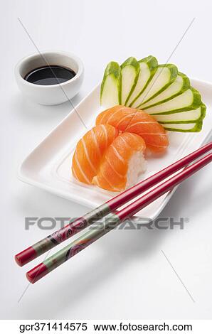 Close-up of sushi with chopsticks and soy sauce View Large Photo Image Stock Photography - Close-up of sushi with chopsticks and soy sauce. Fotosearch