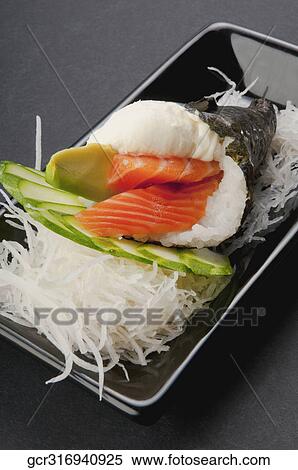 Stock Photography - Close-up of Temaki sushi in a platter. Fotosearch