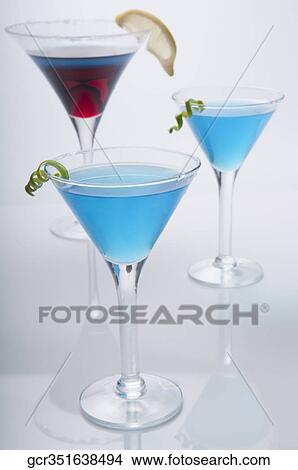 Close-up of three glasses of cocktail View Large Photo Image Picture - Close-up of three glasses of cocktail. Fotosearch