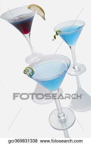 Close-up of three glasses of cocktails View Large Photo Image Stock Photo - Close-up of three glasses of cocktails. Fotosearch