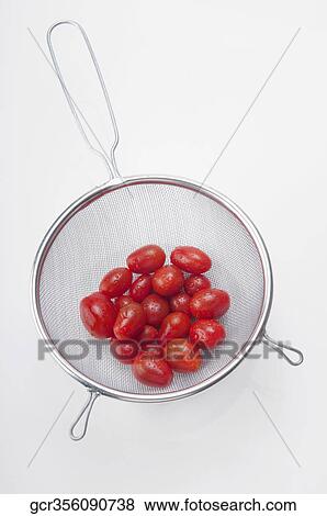 Close-up of tomatoes in a sieve View Large Photo Image Stock Photo - Close-up of tomatoes in a sieve. Fotosearch