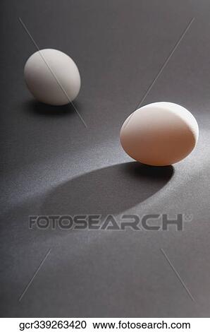 Stock Image - Close-up of two eggs. Fotosearch
