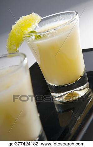 Close-up of two glass of sweet lime juice in a plate View Large Photo Image Stock Image - Close-up of two glass of sweet lime juice in a plate. Fotosearch