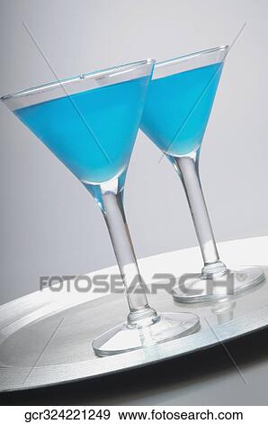 Close-up of two glasses of blue cocktail View Large Photo Image Stock Photo - Close-up of two glasses of blue cocktail. Fotosearch