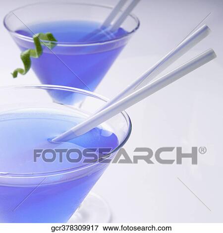 Close-up of two glasses of blue cocktail View Large Photo Image Stock Photo - Close-up of two glasses of blue cocktail. Fotosearch