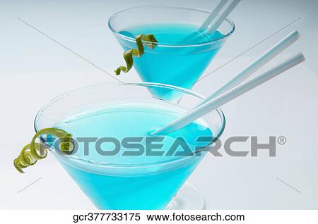 Stock Photography - Close-up of two glasses of blue cocktail. Fotosearch