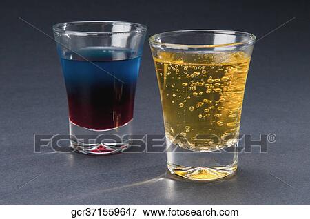 Close-up of two glasses of cocktail and beer View Large Photo Image Stock Photo - Close-up of two glasses of cocktail and beer. Fotosearch