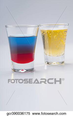 Close-up of two glasses of cocktail and beer View Large Photo Image Stock Photography - Close-up of two glasses of cocktail and beer. Fotosearch