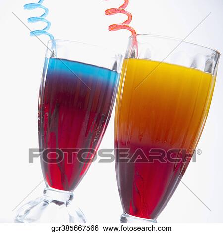 Close-up of two glasses of multicolored cocktails View Large Photo Image Stock Photograph - Close-up of two glasses of multicolored cocktails. Fotosearch