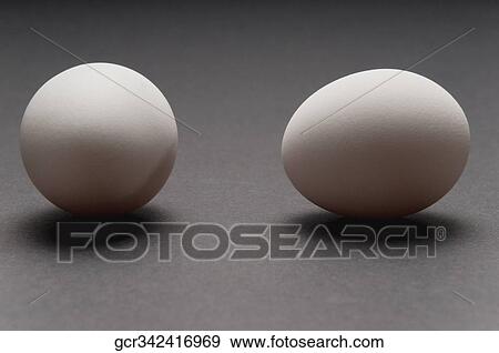 Close-up of two white eggs View Large Photo Image Stock Photo - Close-up of two white eggs. Fotosearch