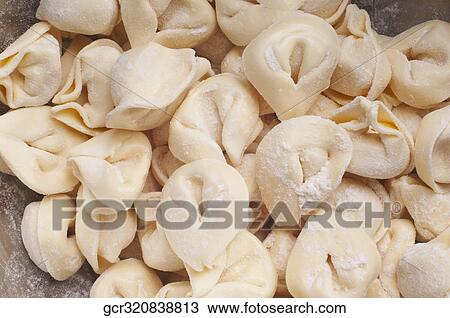 Close-up of uncooked tortellini View Large Photo Image Stock Image - Close-up of uncooked tortellini. Fotosearch