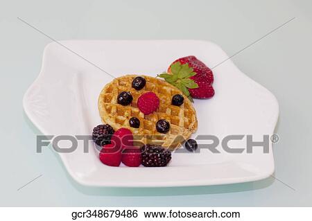 Close-up of waffles with fresh berries View Large Photo Image Stock Photograph - Close-up of waffles with fresh berries. Fotosearch