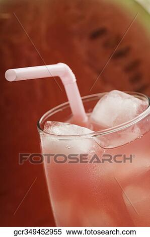 Stock Photography - Close-up of watermelon with a glass of watermelon juice. Fotosearch