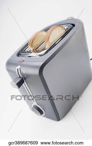 Close-up of white bread in a toaster View Large Photo Image Stock Photo - Close-up of white bread in a toaster. Fotosearch