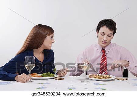 Couple having lunch together View Large Photo Image Picture - Couple having lunch together. Fotosearch