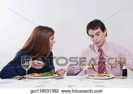 Couple having lunch together View Large Photo Image Stock Image - Couple having lunch together. Fotosearch