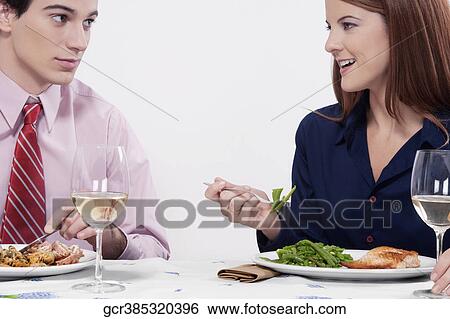 Couple having lunch together View Large Photo Image Stock Photograph - Couple having lunch together. Fotosearch