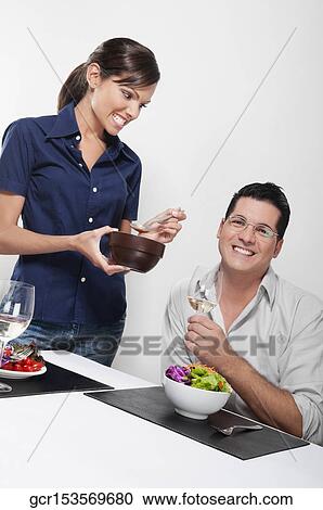 Couple having vegetable salad and drinking white wine View Large Photo Image Stock Image - Couple having vegetable salad and drinking white wine. Fotosearch