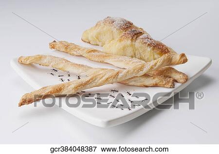 Danish pastry served with breadsticks on a platter View Large Photo Image Stock Photo - Danish pastry served with breadsticks on a platter. Fotosearch