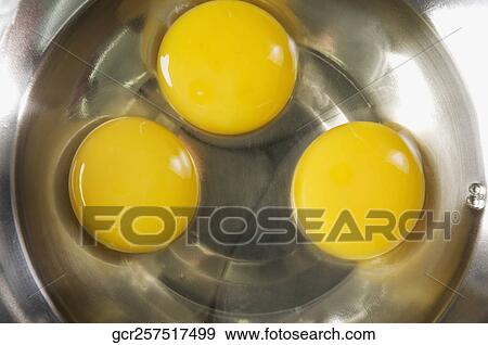 Egg yolk in a bowl View Large Photo Image Stock Photo - Egg yolk in a bowl. Fotosearch