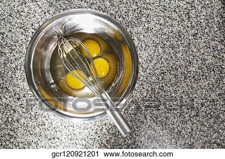 Egg yolk with an egg beater in a bowl View Large Photo Image Stock Image - Egg yolk with an egg beater in a bowl. Fotosearch