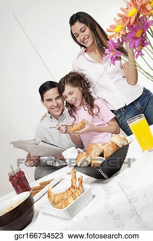 Family at a breakfast table View Large Photo Image Stock Image - Family at a breakfast table. Fotosearch