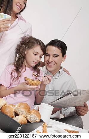Stock Photo - Family at a breakfast table. Fotosearch