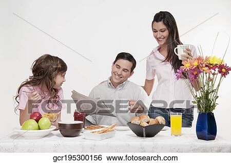 Family at a breakfast table View Large Photo Image Stock Photograph - Family at a breakfast table. Fotosearch