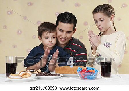 Family celebrating birthday View Large Photo Image Stock Photo - Family celebrating birthday. Fotosearch