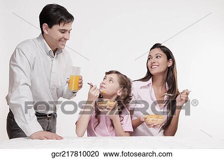 Family having breakfast View Large Photo Image Stock Image - Family having breakfast. Fotosearch