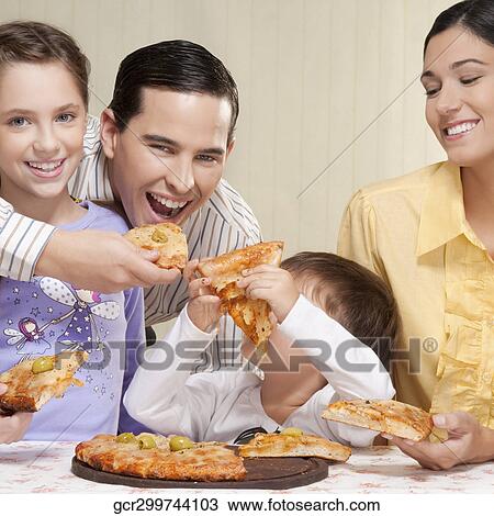 Family sharing a pizza View Large Photo Image Stock Image - Family sharing a pizza. Fotosearch