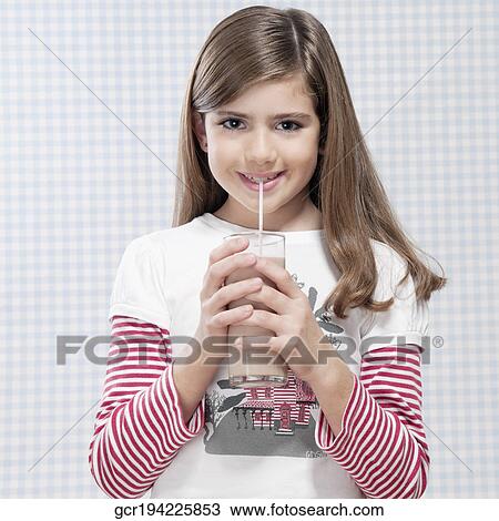 Girl drinking milk with a straw View Large Photo Image Stock Image - Girl drinking milk with a straw. Fotosearch