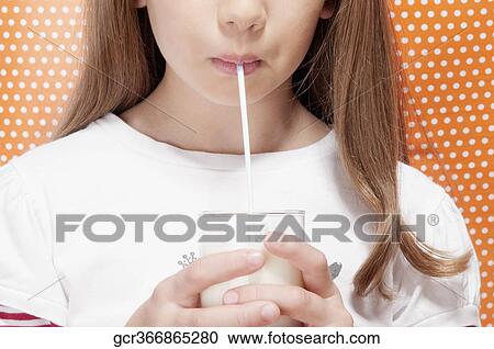 Girl drinking milk with a straw View Large Photo Image Stock Image - Girl drinking milk with a straw. Fotosearch