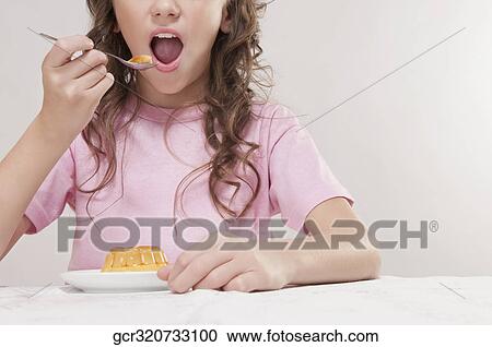 Girl eating jelly View Large Photo Image Stock Image - Girl eating jelly. Fotosearch