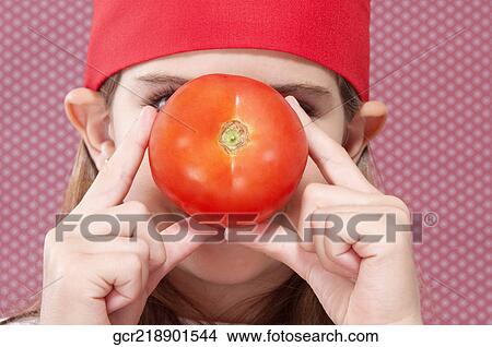 Girl holding a tomato View Large Photo Image Picture - Girl holding a tomato. Fotosearch