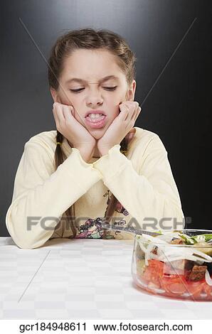 Girl refusing fruit salad View Large Photo Image Stock Image - Girl refusing fruit salad. Fotosearch