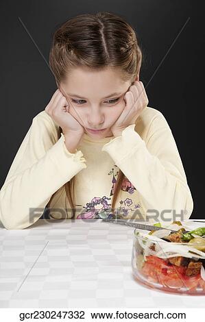Girl refusing fruit salad View Large Photo Image Stock Image - Girl refusing fruit salad. Fotosearch