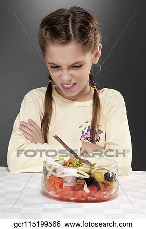 Girl refusing fruit salad View Large Photo Image Stock Photograph - Girl refusing fruit salad. Fotosearch