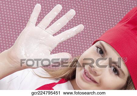 Girl showing her hand covered with flour View Large Photo Image Stock Image - Girl showing her hand covered with flour. Fotosearch
