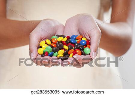 Handful of candy View Large Photo Image Stock Photography - Handful of candy. Fotosearch