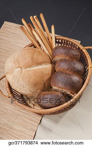 High angle view of a basket of assorted breads View Large Photo Image Picture - High angle view of a basket of assorted breads. Fotosearch