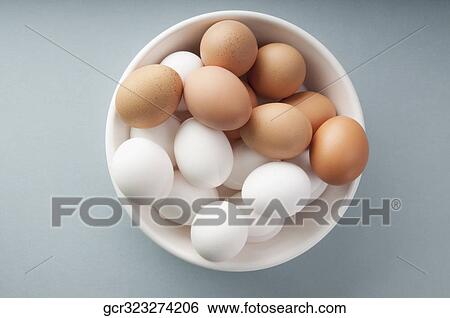 High angle view of a bowl of brown and white eggs View Large Photo Image Stock Photograph - High angle view of a bowl of brown and white eggs. Fotosearch