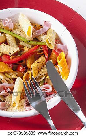 High angle view of a bowl of penne pasta and ham salad View Large Photo Image Stock Photo - High angle view of a bowl of penne pasta and ham salad. Fotosearch