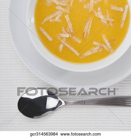 High angle view of a bowl of pumpkin soup View Large Photo Image Picture - High angle view of a bowl of pumpkin soup. Fotosearch
