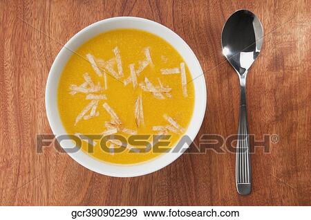 Stock Photo - High angle view of a bowl of pumpkin soup. Fotosearch