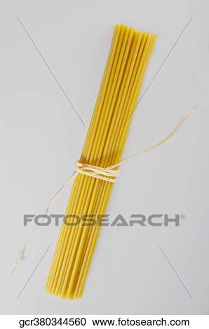 High angle view of a bundle of uncooked spaghetti View Large Photo Image Stock Image - High angle view of a bundle of uncooked spaghetti. Fotosearch