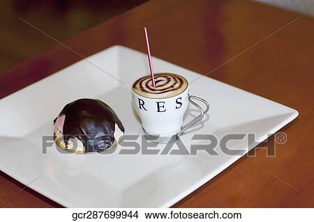 High angle view of a chocolate tart with a cup of coffee View Large Photo Image Picture - High angle view of a chocolate tart with a cup of coffee. Fotosearch
