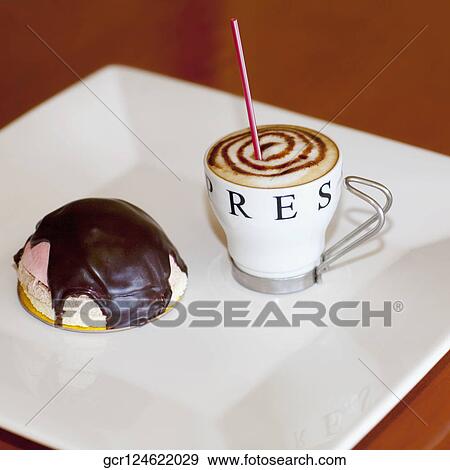 High angle view of a chocolate tart with a cup of coffee View Large Photo Image Stock Photo - High angle view of a chocolate tart with a cup of coffee. Fotosearch