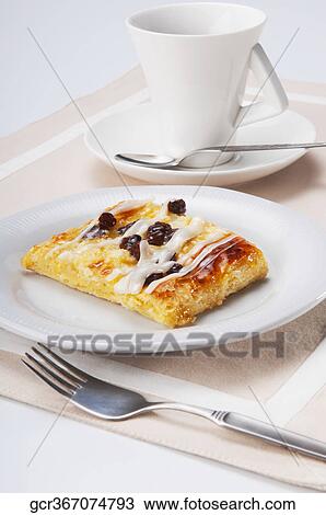 High angle view of a Danish pastry with a cup of coffee View Large Photo Image Stock Image - High angle view of a Danish pastry with a cup of coffee. Fotosearch