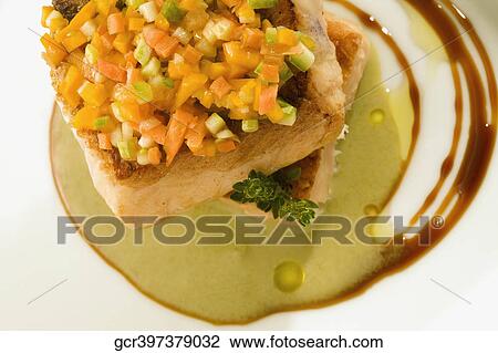 High angle view of a fish steak garnished with chopped peppers View Large Photo Image Stock Image - High angle view of a fish steak garnished with chopped peppers. Fotosearch